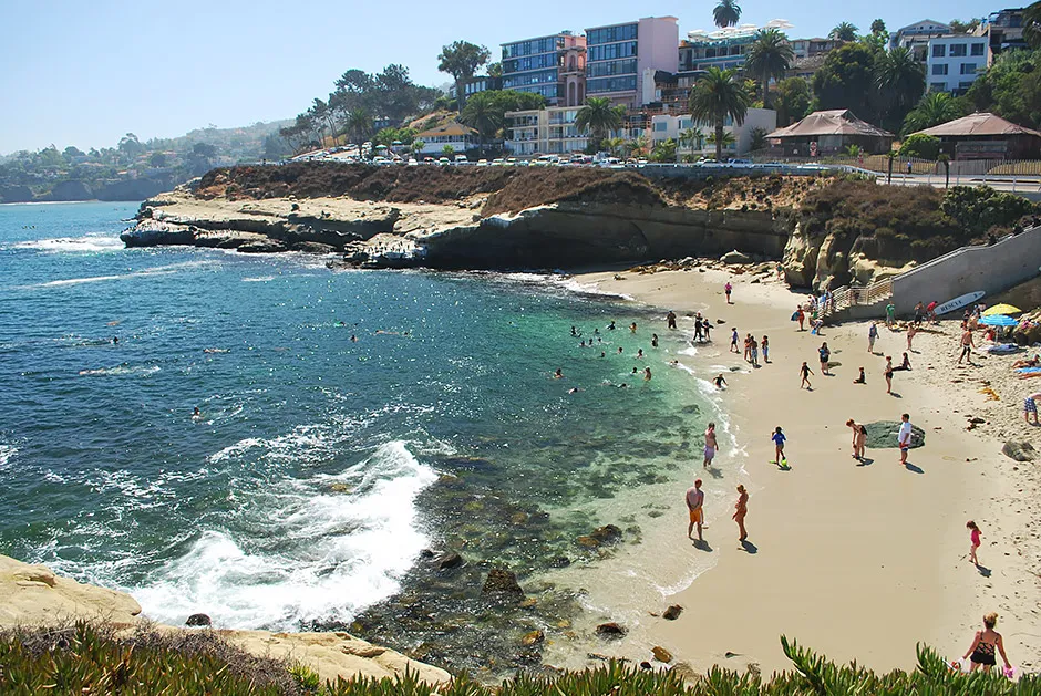 The cove and sandstone cliffs of La Jolla, where the kayak and snorkel tour explores the sea caves